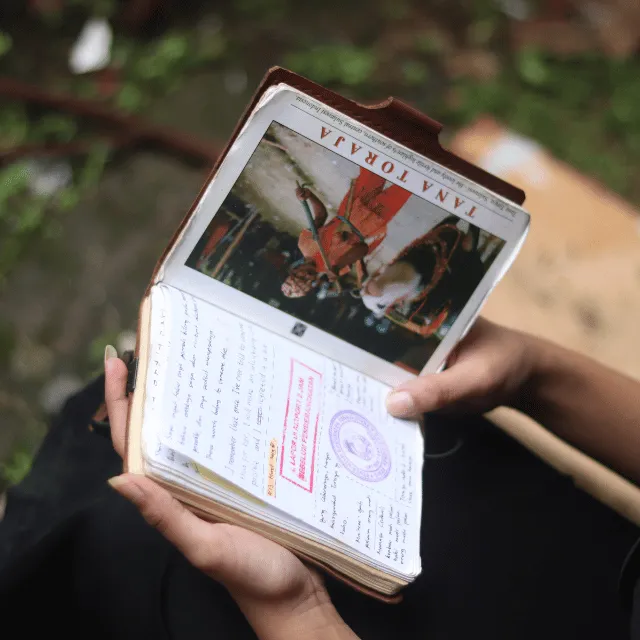 Leather Journal Held By Hand