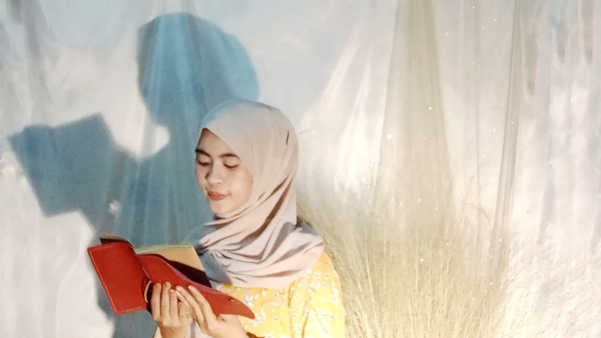 Woman Reading Red Leather Notebook