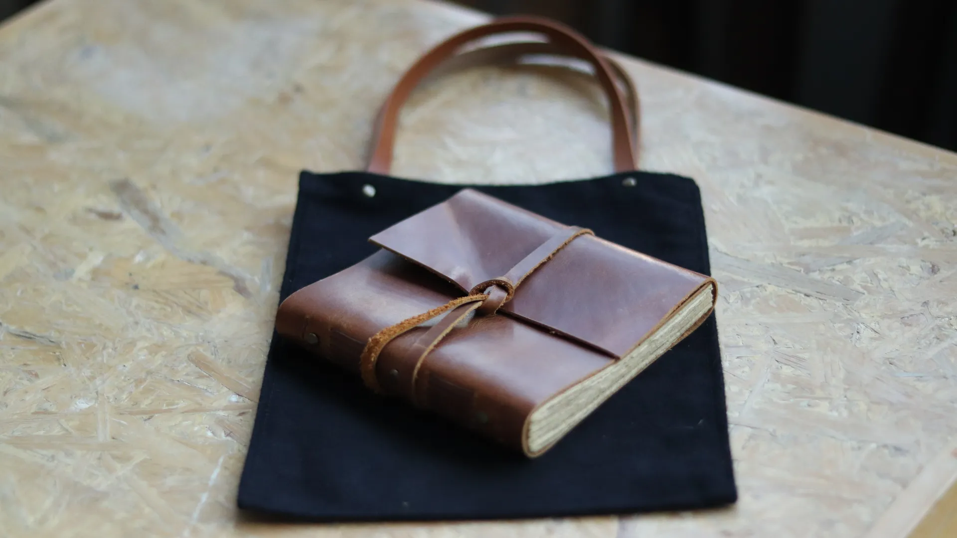 Brown Leather Journal In Black Canvas Tote Bag 1