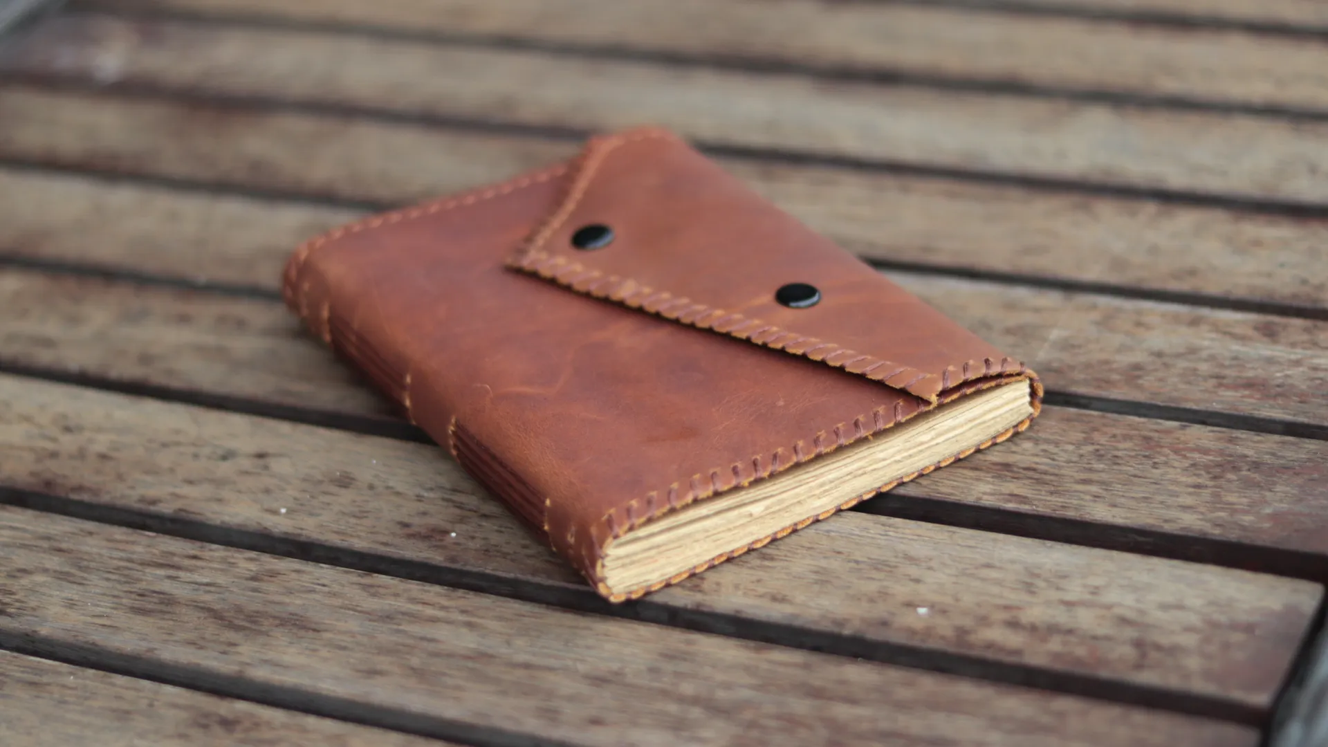Brown Leather Journal Open On Wood