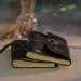 Two Black Leather Notebooks On Table