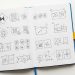 Logo Design Sketches In Notebook