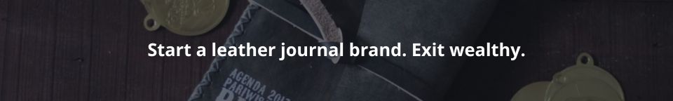 Leather journal stacks representing wealth building through brand equity