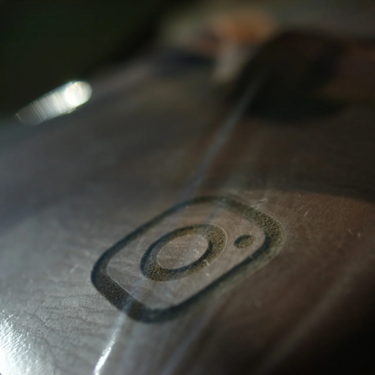 An Instagram logo debossed onto the surface of a leather journal cover.