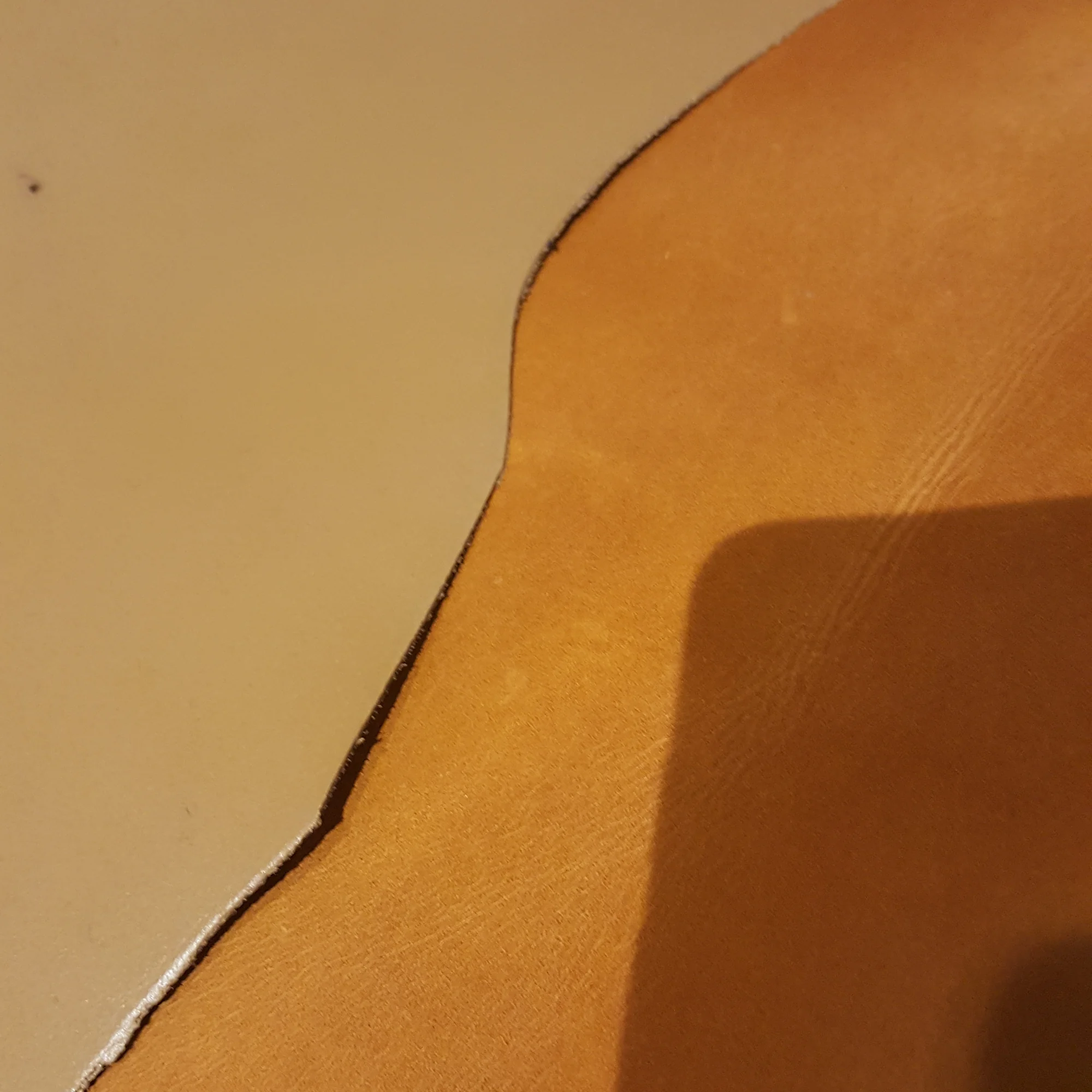 Two kinds of leather with different textures and colours side by side