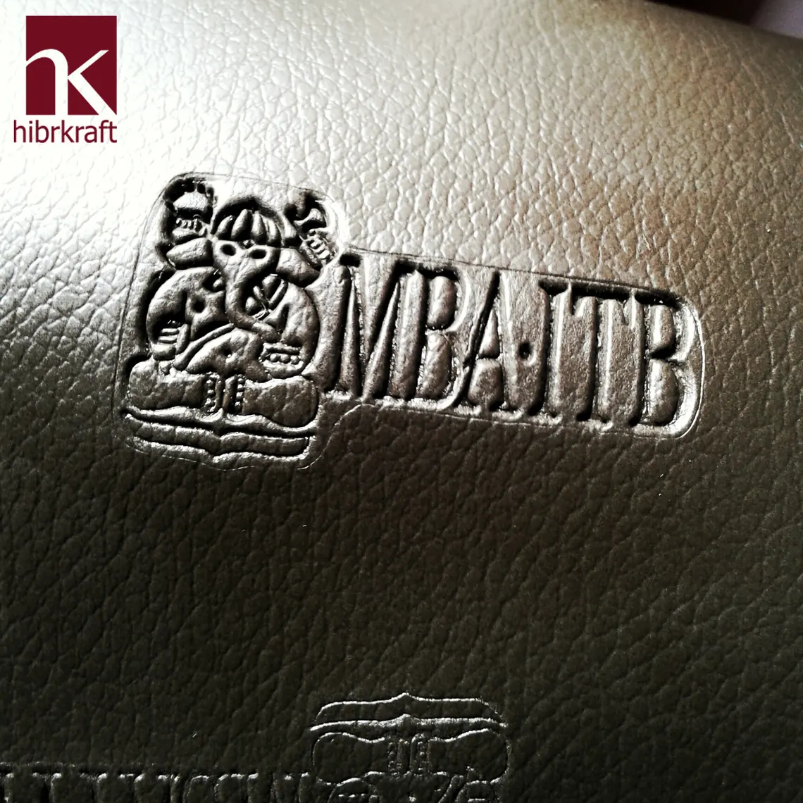 The MBA ITB logo debossed in leather