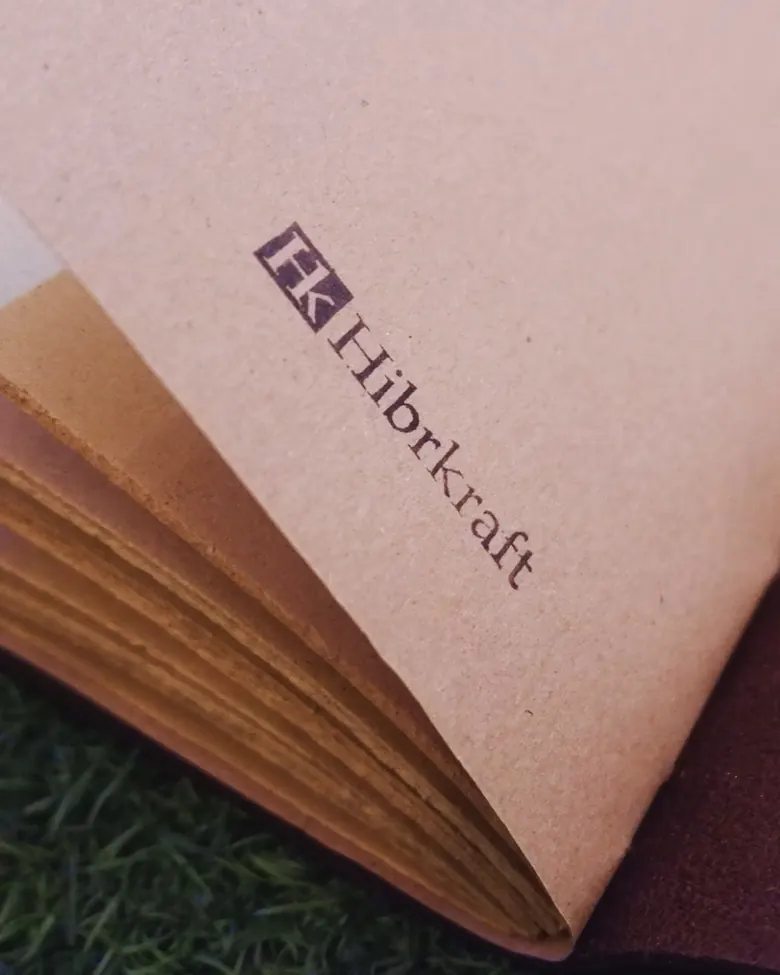A journal stamped with the Hibrkraft logo on paper