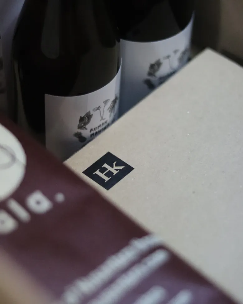 The Hibrkraft logo on a cardboard box