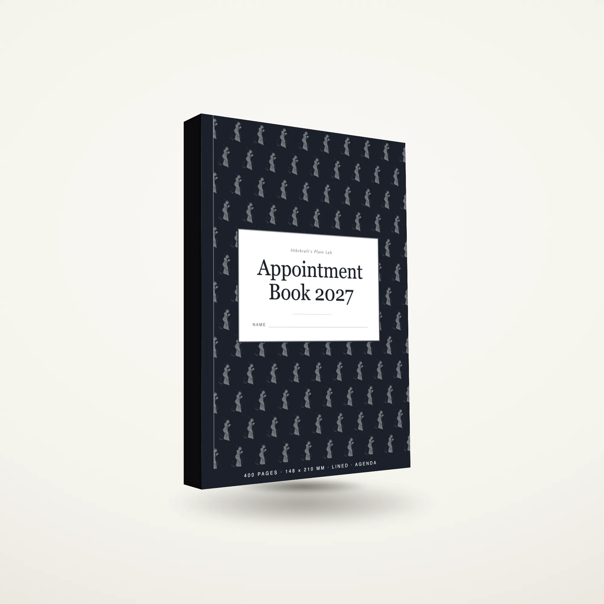 Appointment Book 2027 A5 de pé e fechado sobre uma superfície lisa, capa com um motivo de silhuetas de figuras, com aproximadamente vinte e três milímetros de espessura.
