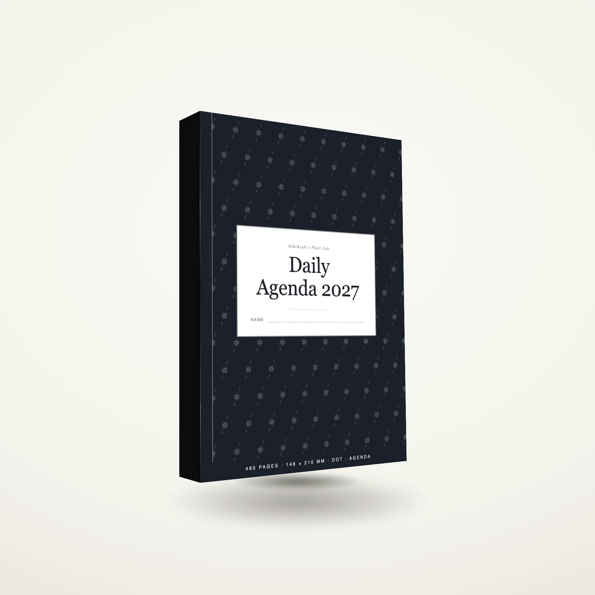 A5 Daily Agenda 2027 standing closed, matte cover, noticeably thick against a plain surface, about 27.46 mm across the spine.