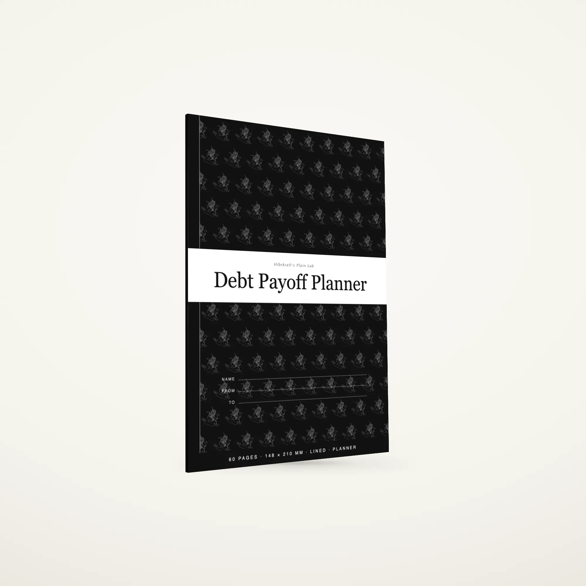 A5 Debt Payoff Planner standing closed, true-black band cover with an ornate royal motif reversed out in white, about three and a half millimetres thick.