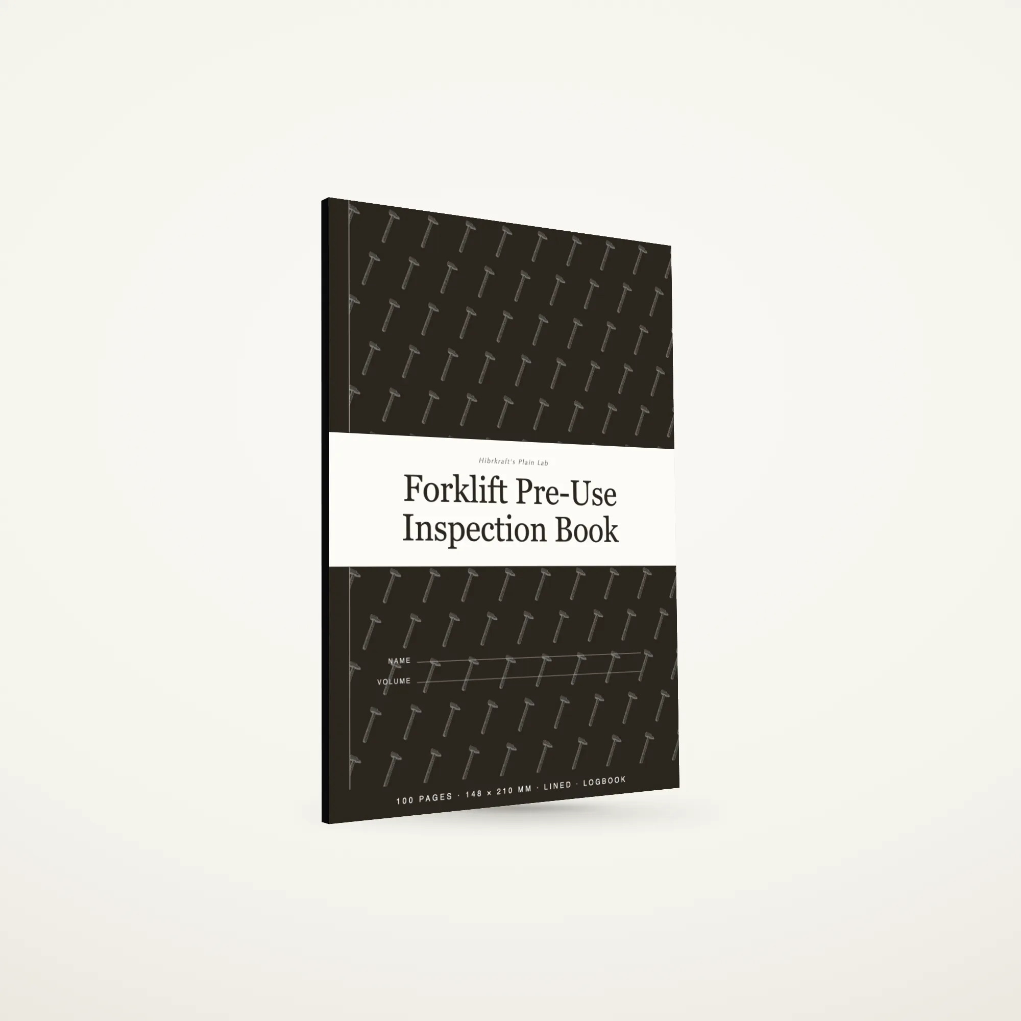 A5 forklift pre-use inspection book standing closed on a plain surface, dark cover with a full-width band and a tools motif, about six millimetres thick.