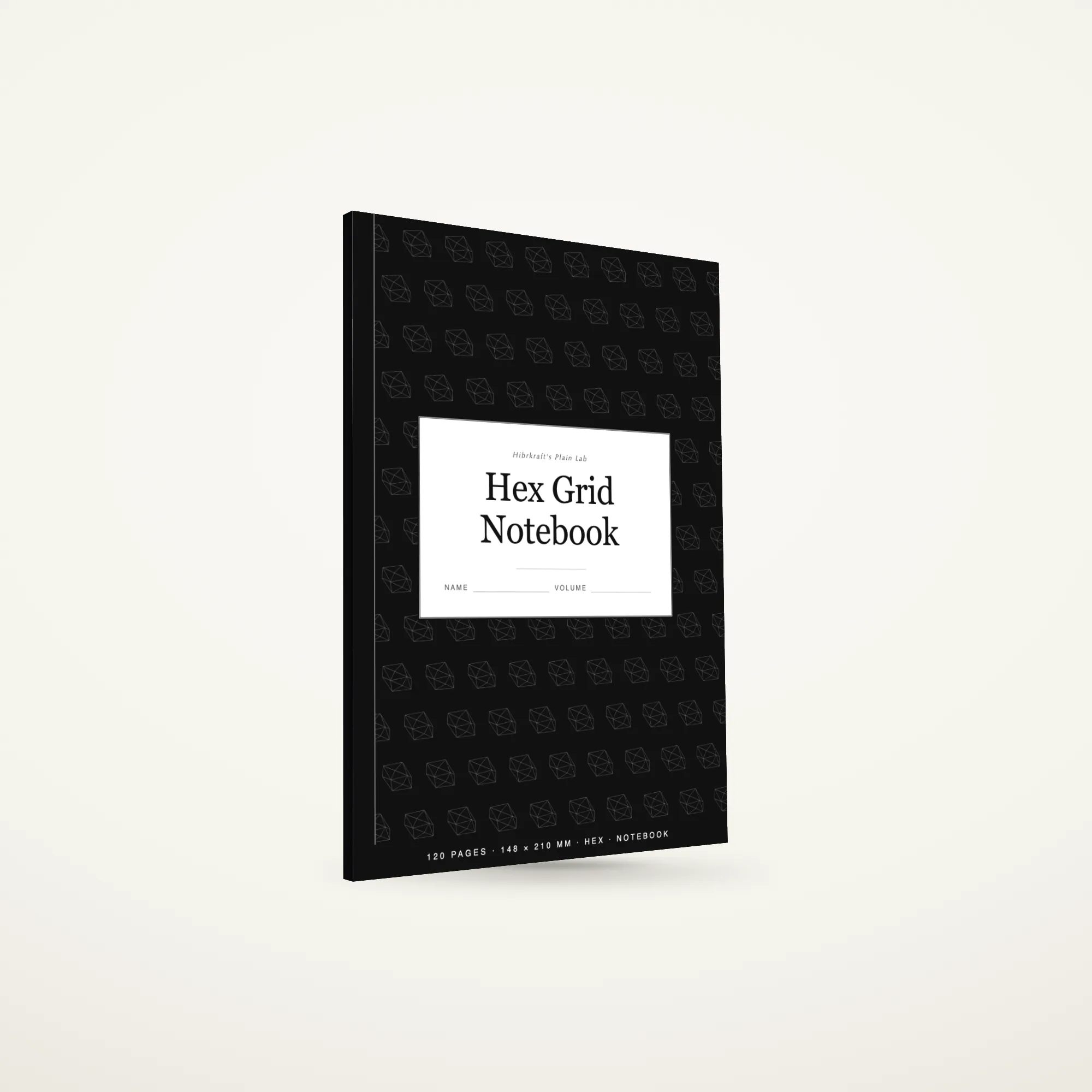 A5 Hex Grid Notebook standing closed, ink-black cover with a gem motif reversed out, about seven millimetres thick.