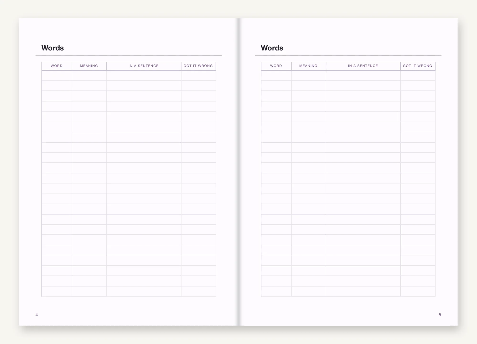 An opening of Language Insert: two facing pages headed Words, each ruled into four columns for the word, its meaning, the word used in a sentence, and a column for the times you got it wrong.