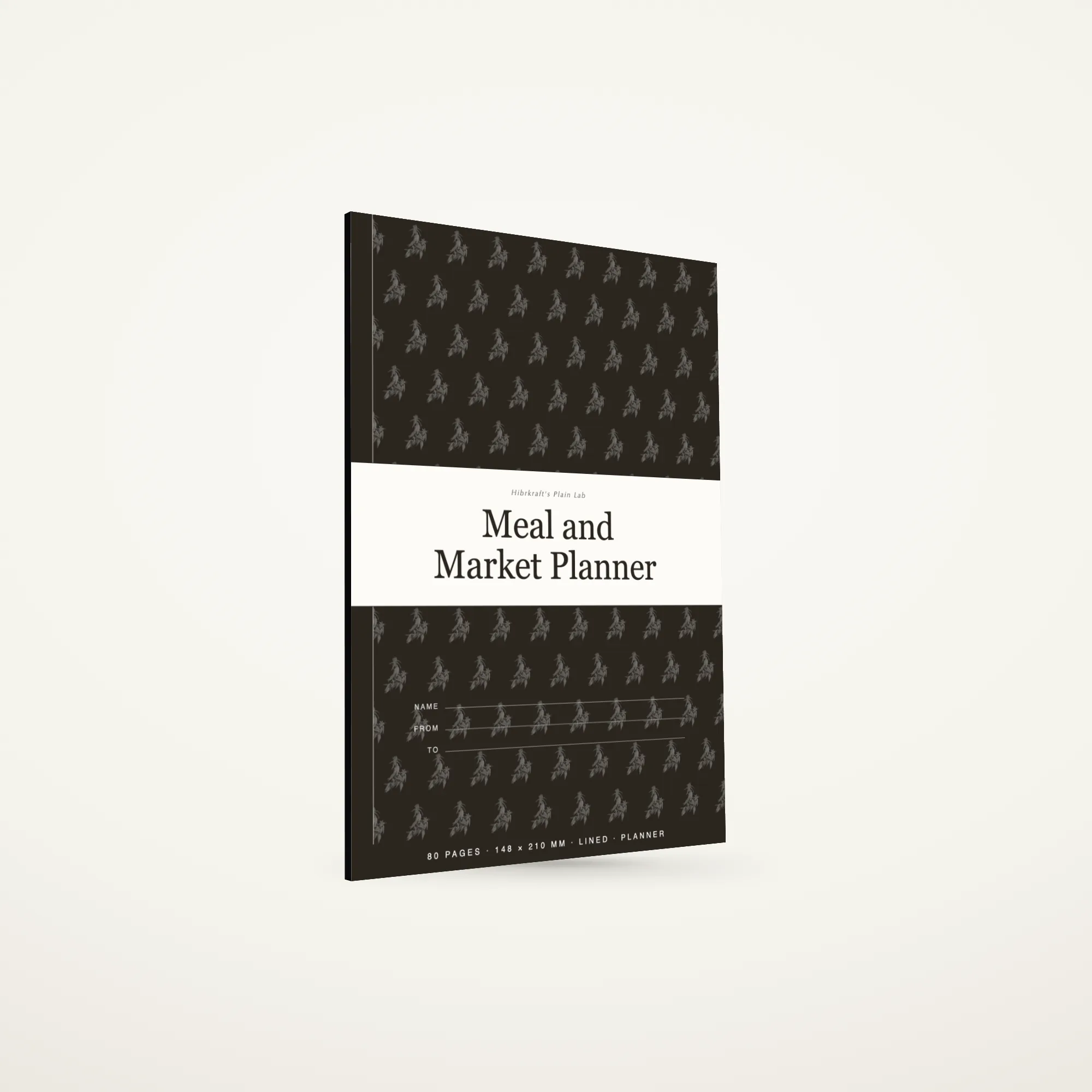A5 Meal and Market Planner standing closed, dark umber band cover with a botanical motif reversed out in cream, about four and a half millimetres thick.