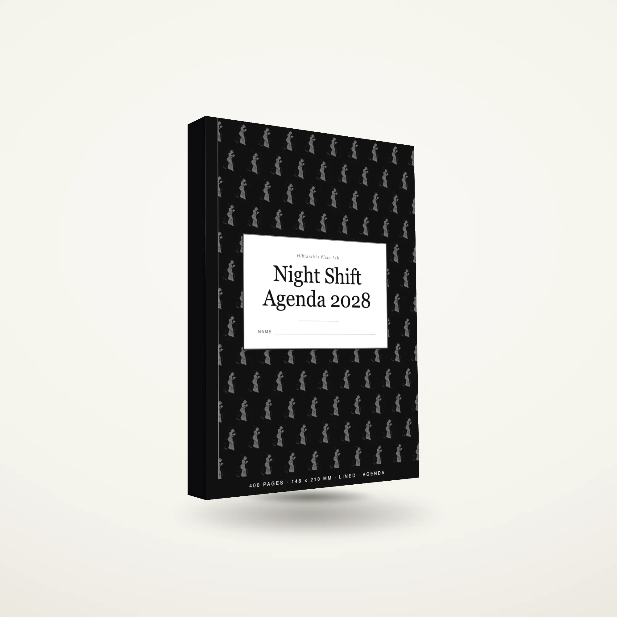 Night Shift Agenda 2028 A5 berdiri tertutup di atas permukaan polos, sampul agenda bertanggal.