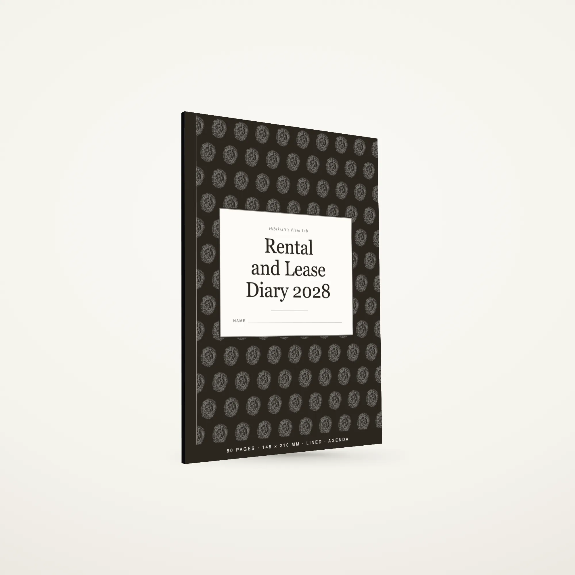 A5 Rental and Lease Diary 2028 standing closed on a plain surface, dark cover with a house key motif, about six millimetres thick.