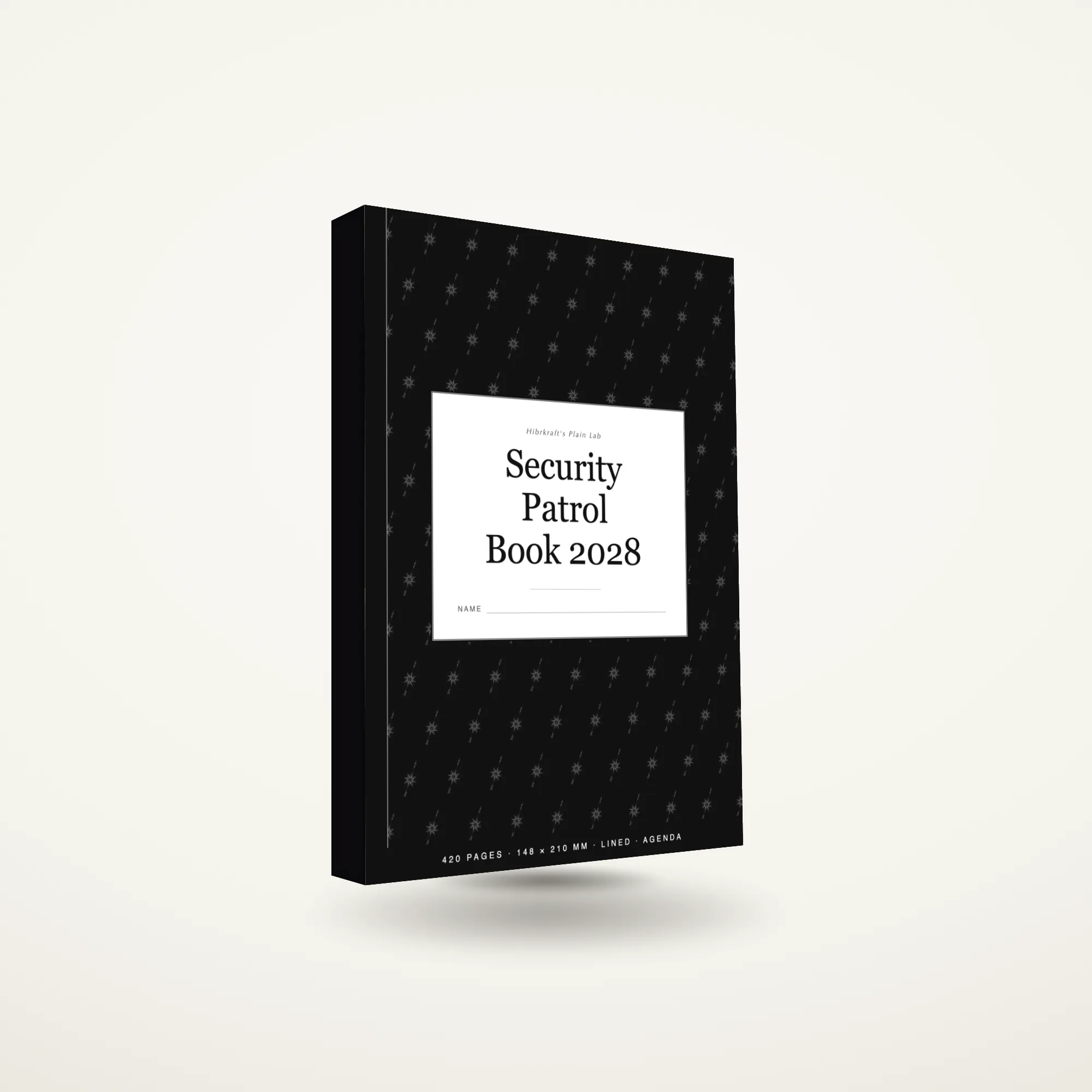 Security Patrol Book 2028 A5 de pé e fechado sobre uma superfície lisa, capa com um motivo de bússola, com aproximadamente vinte e quatro milímetros de espessura.