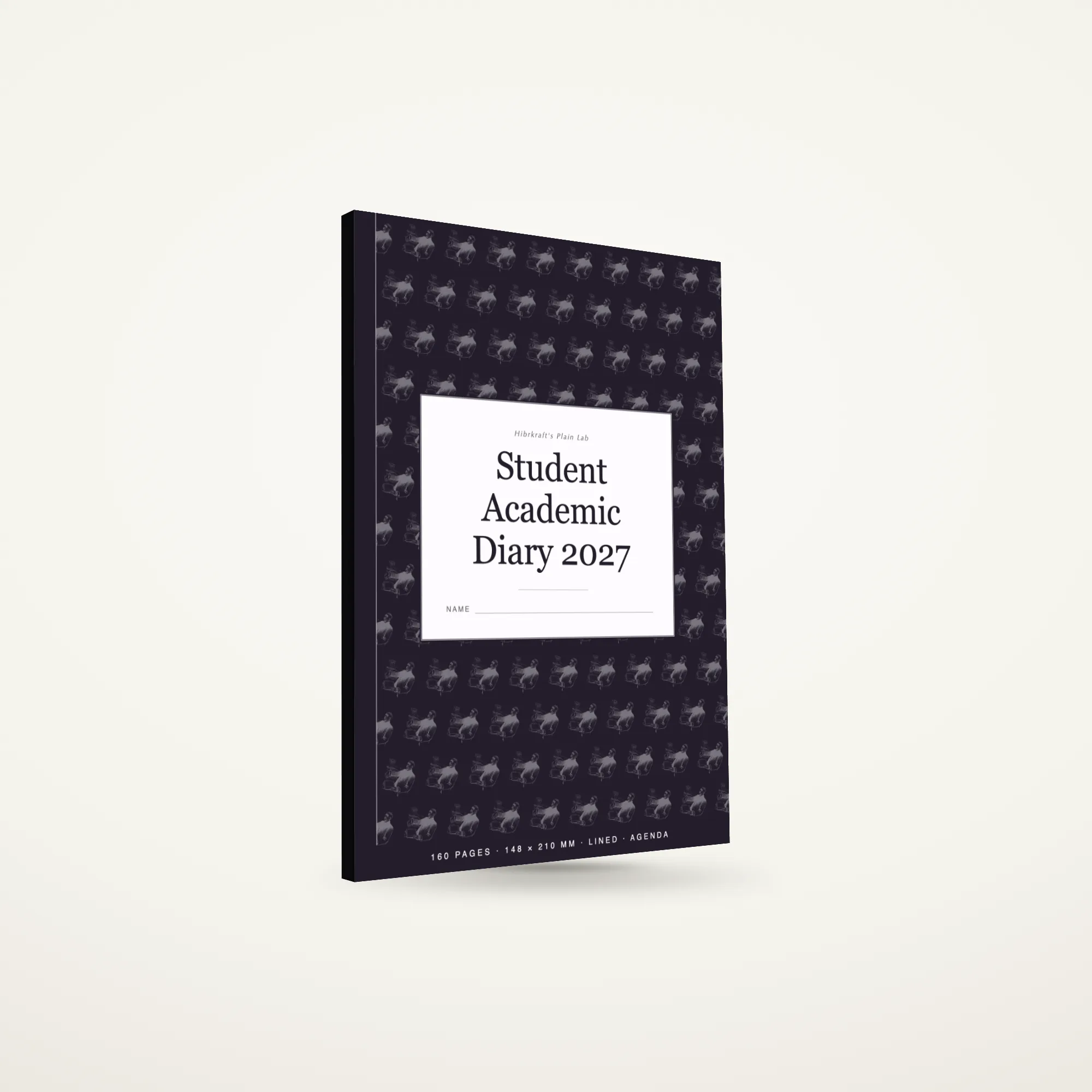 Student Academic Diary 2027 A5 berdiri tertutup di atas permukaan polos, sampul gelap dengan motif pensil dan buku terbuka, tebal sekitar sembilan milimeter.