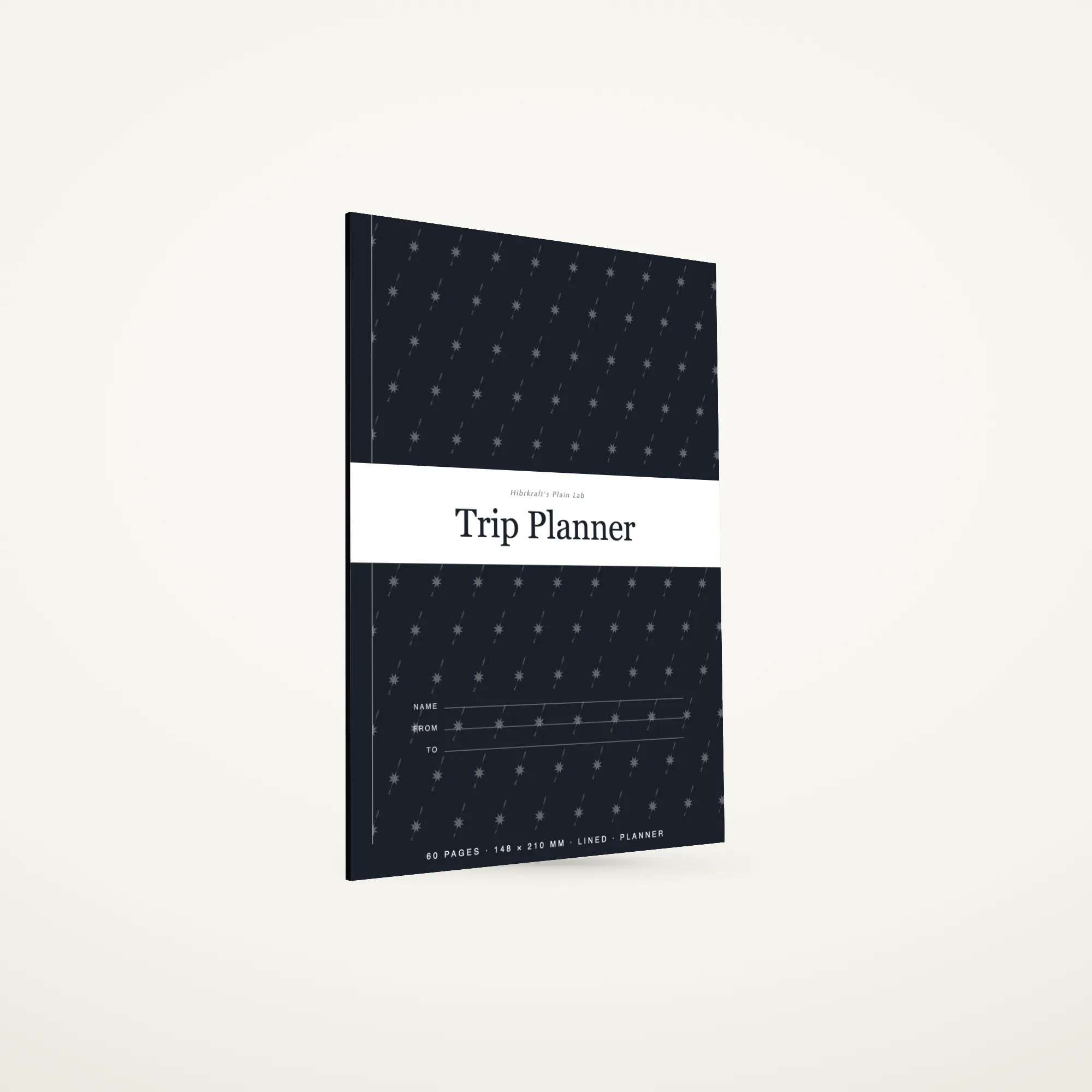 Trip Planner A5 de pé e fechado sobre uma superfície lisa, capa com uma faixa no terço inferior e o título a negativo, com cerca de três milímetros de espessura.