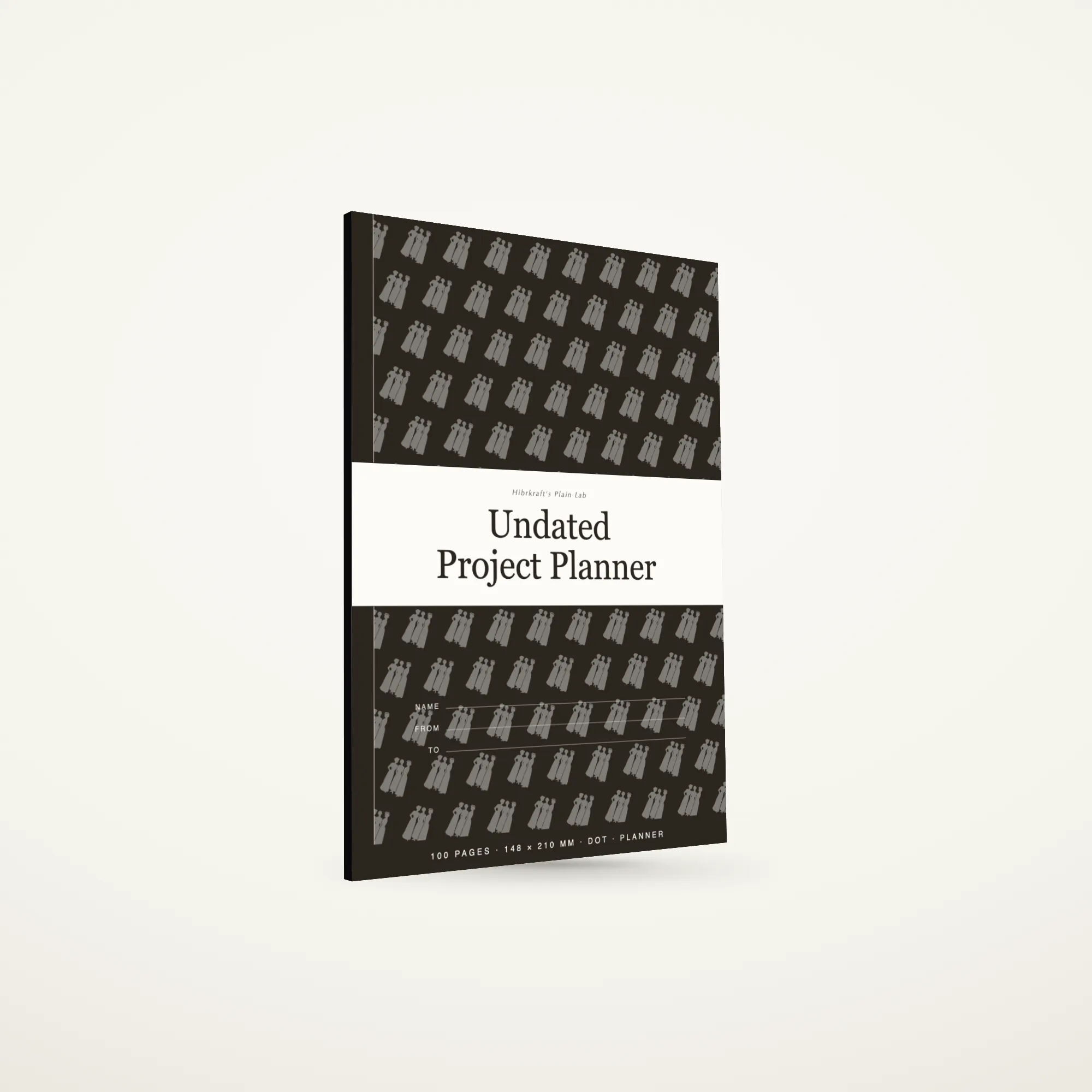 Undated Project Planner A5 de pé e fechado sobre uma superfície lisa, capa com uma faixa no terço inferior e o título a negativo, com cerca de seis milímetros de espessura.