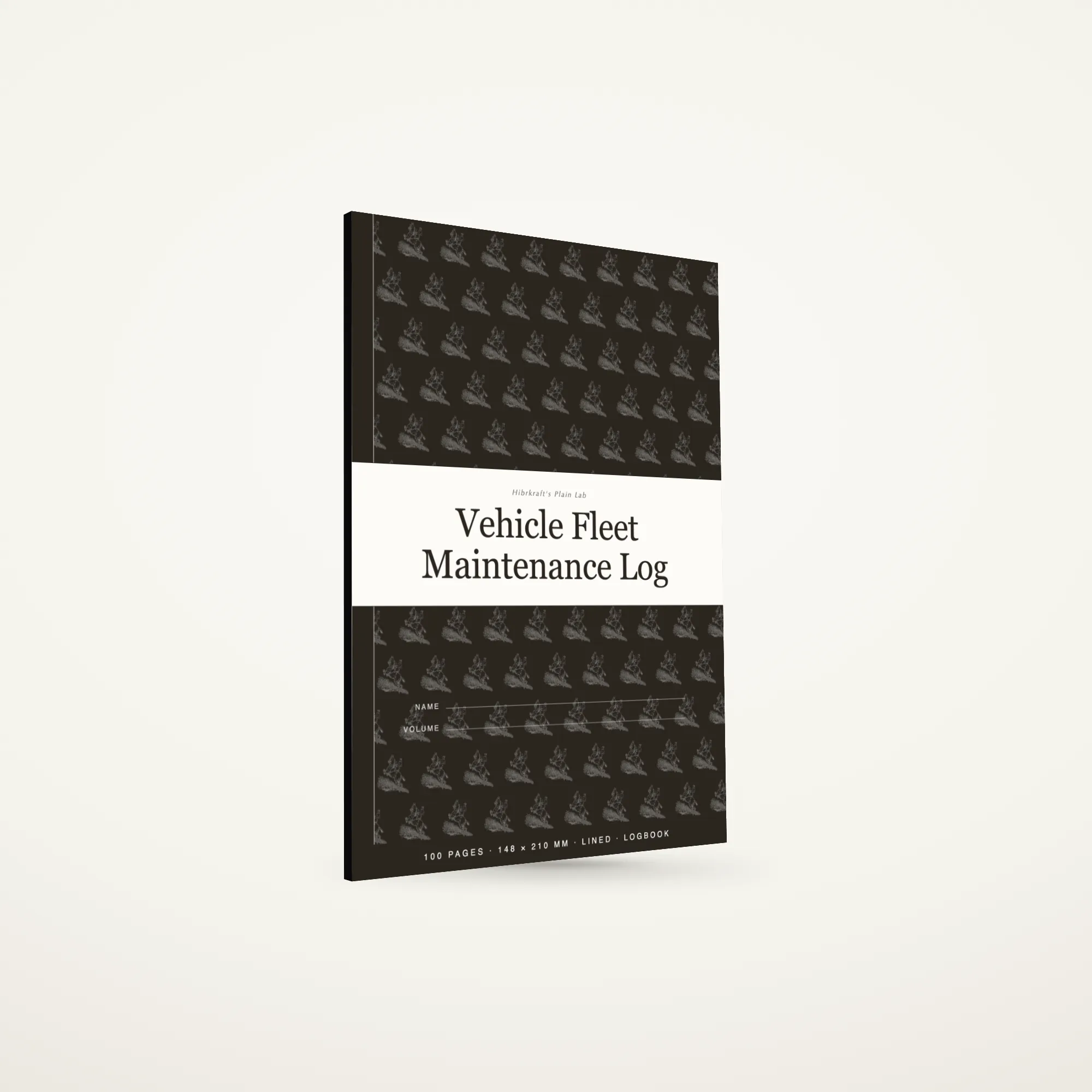 O Vehicle Fleet Maintenance Log A5 de pé e fechado sobre uma superfície lisa, capa escura com uma faixa a toda a largura e um motivo de ferramentas, com cerca de seis milímetros de espessura.