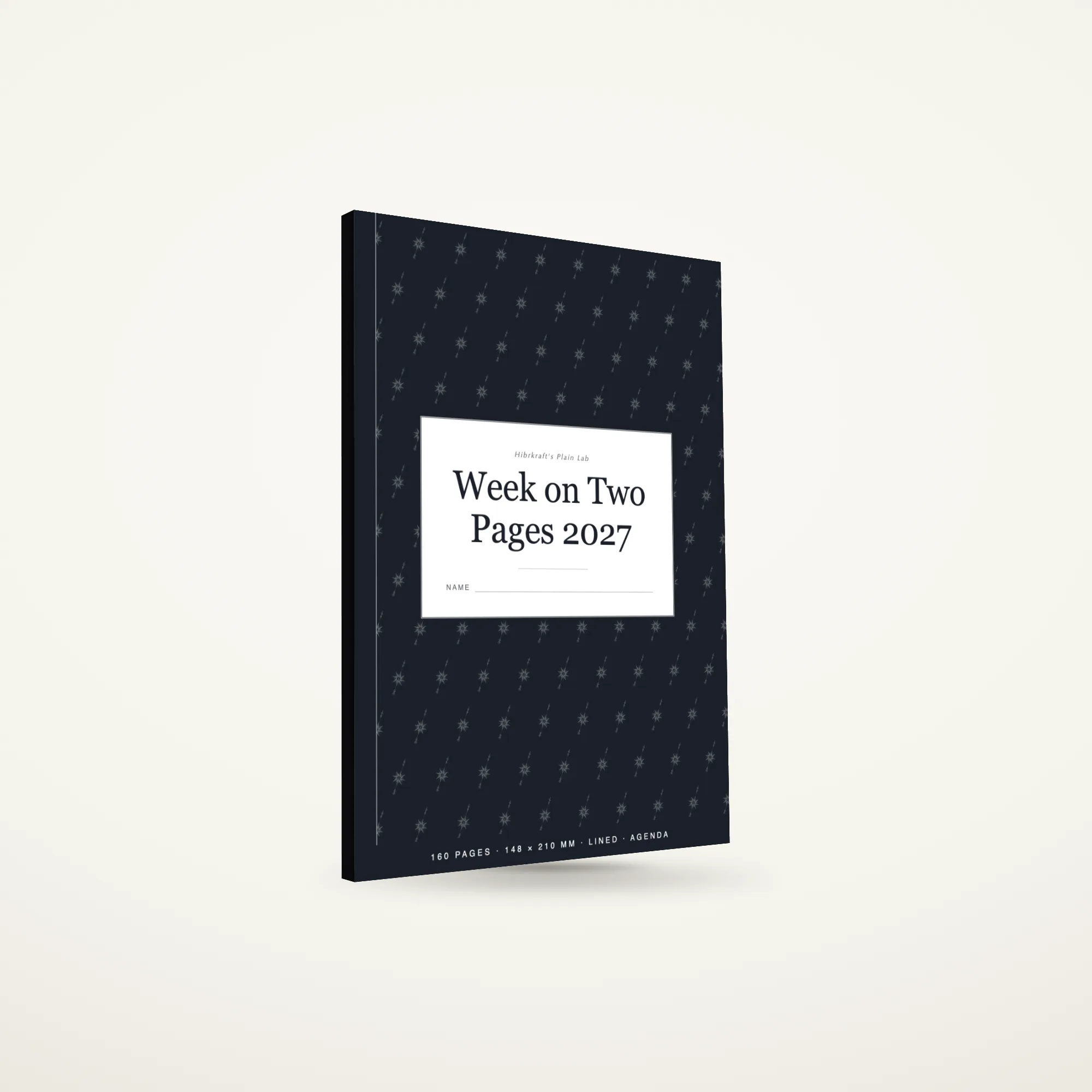 Week on Two Pages 2027 A5 berdiri tertutup di atas permukaan polos, sampul gelap dengan motif kisi kalender, tebal sekitar sembilan milimeter.