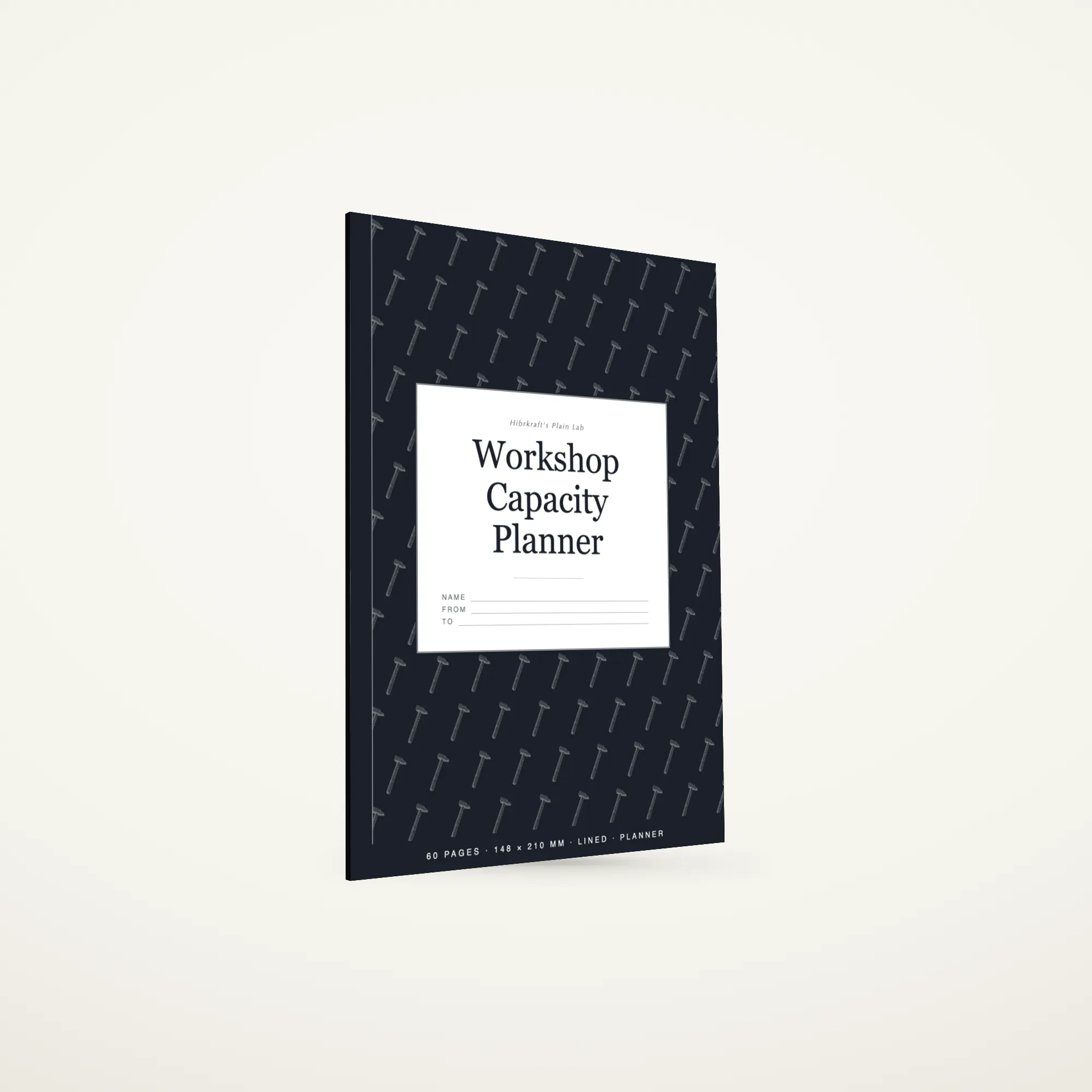 Workshop Capacity Planner A5 de pé e fechado sobre uma superfície lisa, capa com uma faixa no terço inferior e o título a negativo, com cerca de três milímetros de espessura.
